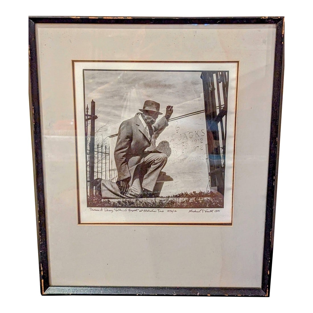 1980s "Thomas A. Dorsey at Mahalia Jackson's Tomb" by Renowned Photographer Michael P. Smith: Michael P. Smith (1937-2008) was a celebrated American photographer, primarily known for his extensive documentary work capturing the rich cultural, musical, and spiritual life of New Orleans. His