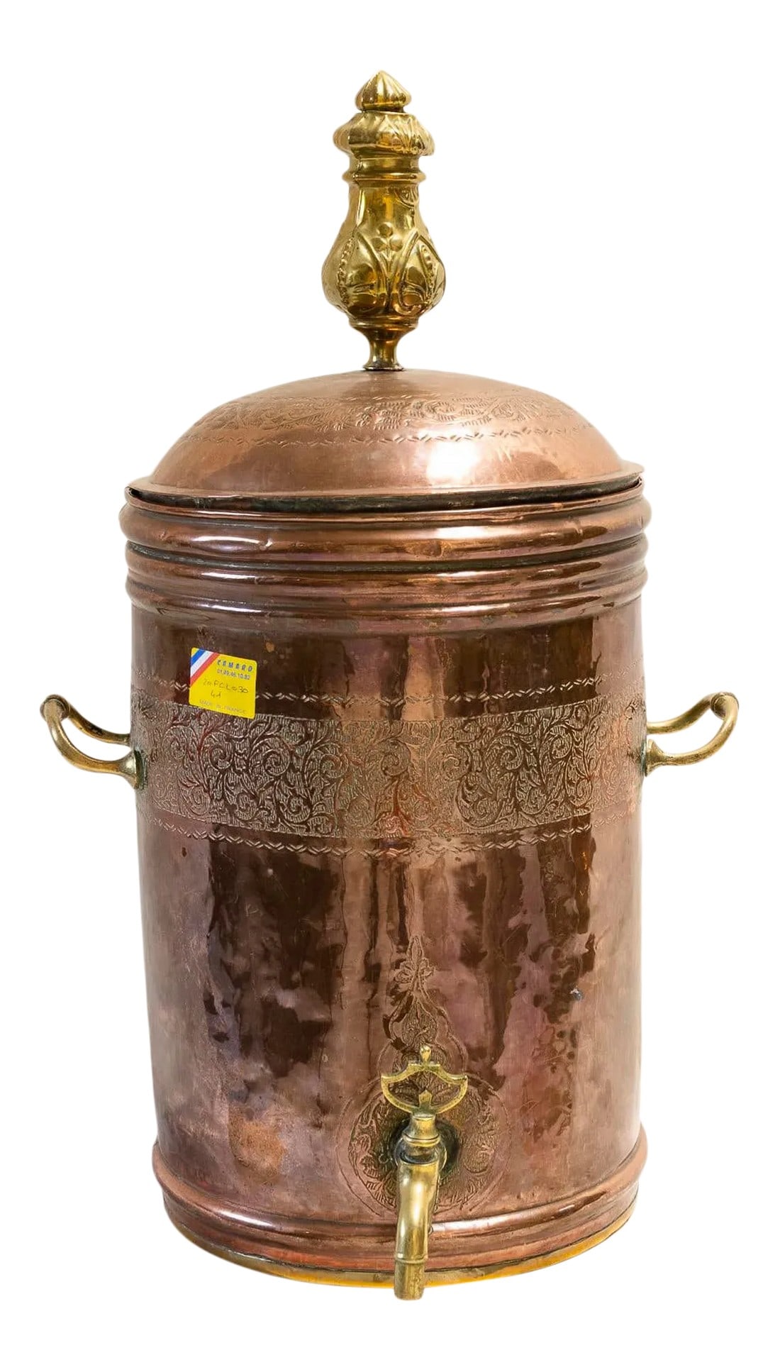 Late 19th Century Dutch Copper Beverage Dispenser: This rare late 19th century copper beverage dispenser features hand-tooled decorations, brass handles and spigot, and a pressed tin lid handle. Originally of Dutch origin, this dispenser was acquired
