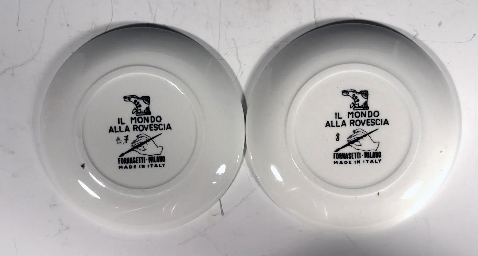 Piero Fornasetti Complete Set of Eight Ceramic Coasters, Il Mondo Alla Rovecia Pattern, ("The Tops - 7
