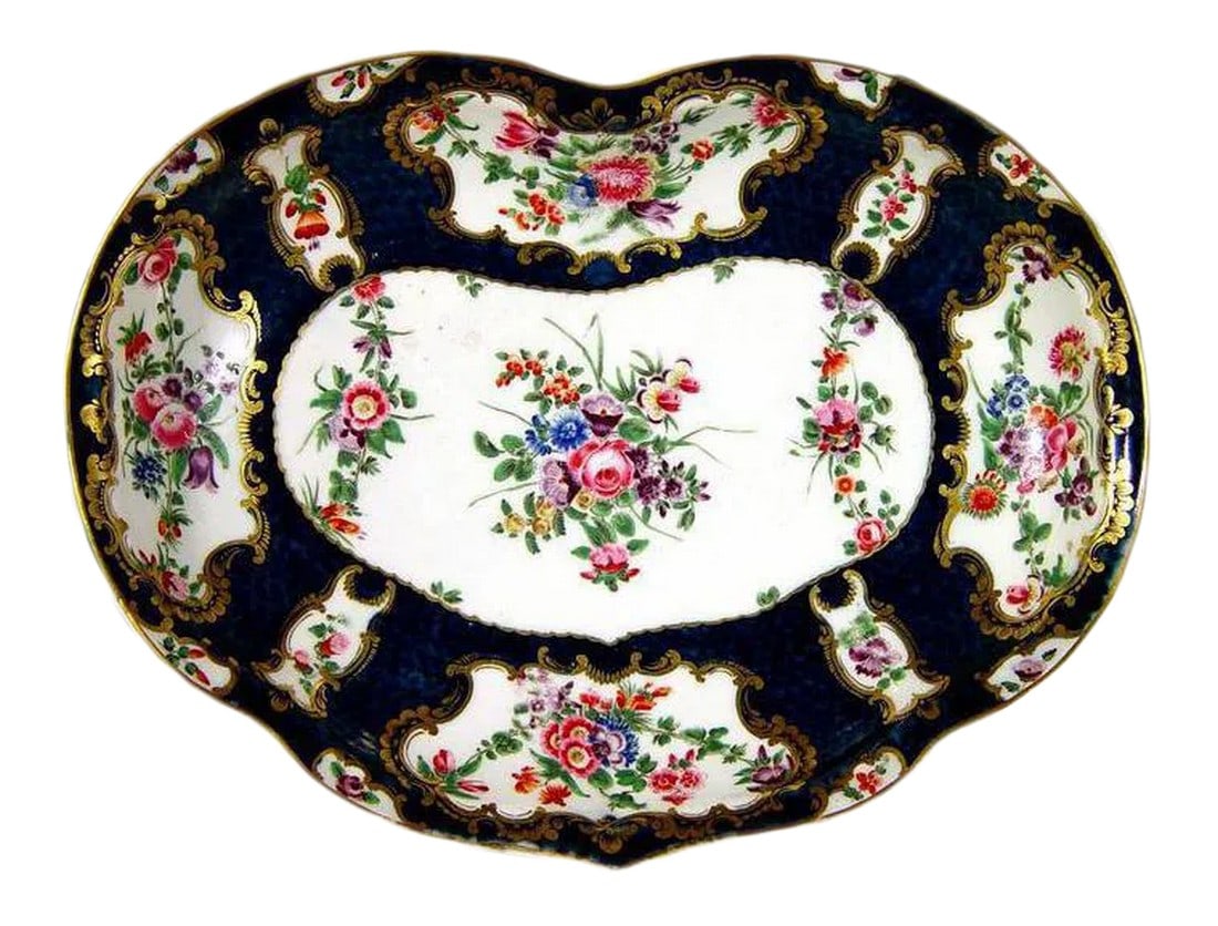 First Period Worcester Porcelain Botanical Blue-Scale Kidney Shaped Dish: Rococo Luxury: Worcester Blue Scale Porcelain Kidney Dish Object: Kidney-Shaped Serving Dish Origin: Worcester Porcelain Factory, England Date: Circa 1770 (First Period) Medium: Soft-Paste Porcelain D