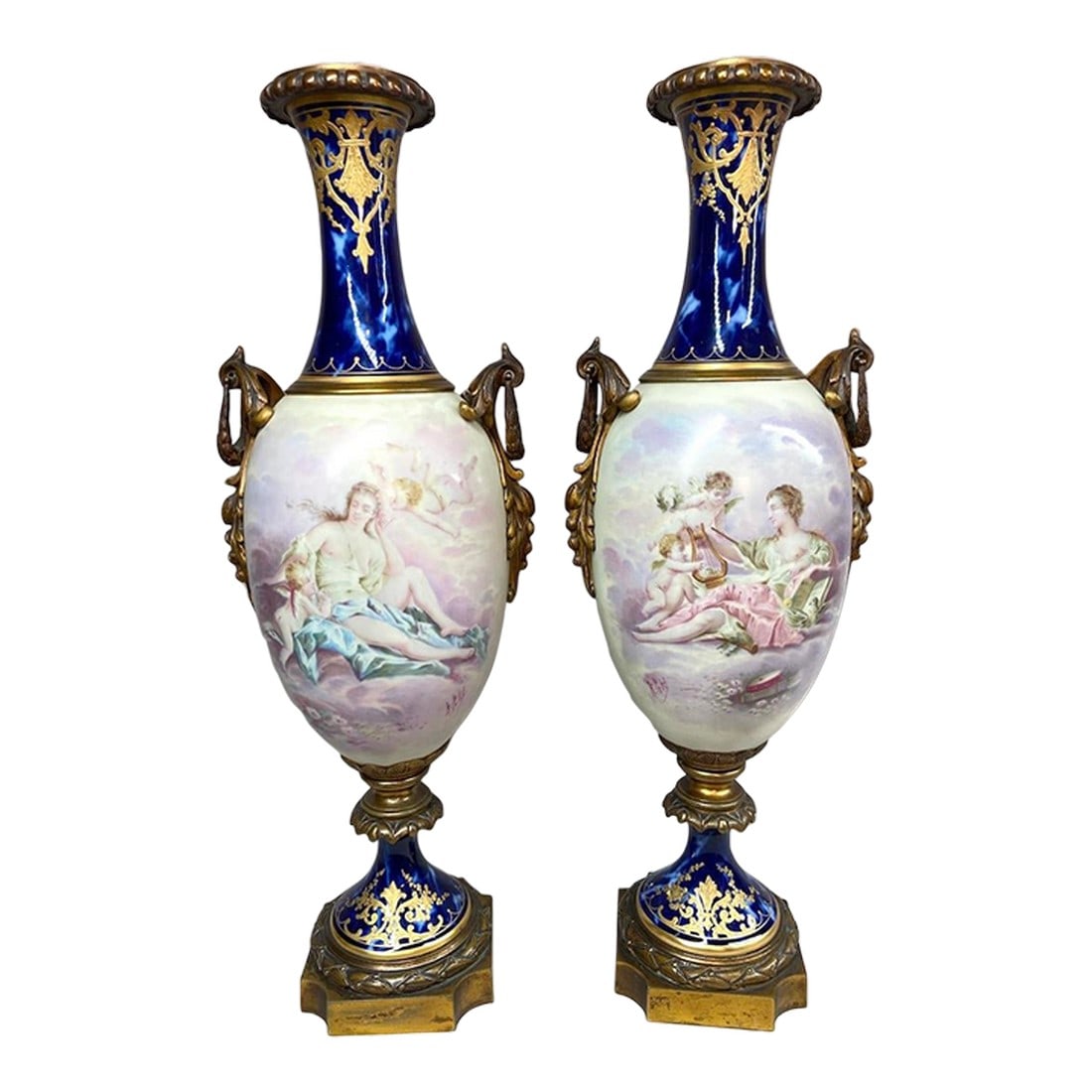 1850s Sevres French Gilded Bronze Blue Porcelain Vases - Pair: Date/Period: Circa 1840–1860 Maker/Brand: Sèvres, France Style: Louis XVI Revival / Neoclassical Color: Cobalt Blue with Gold and Multicolor Accents Material: Porcelain and Gilded Bronze