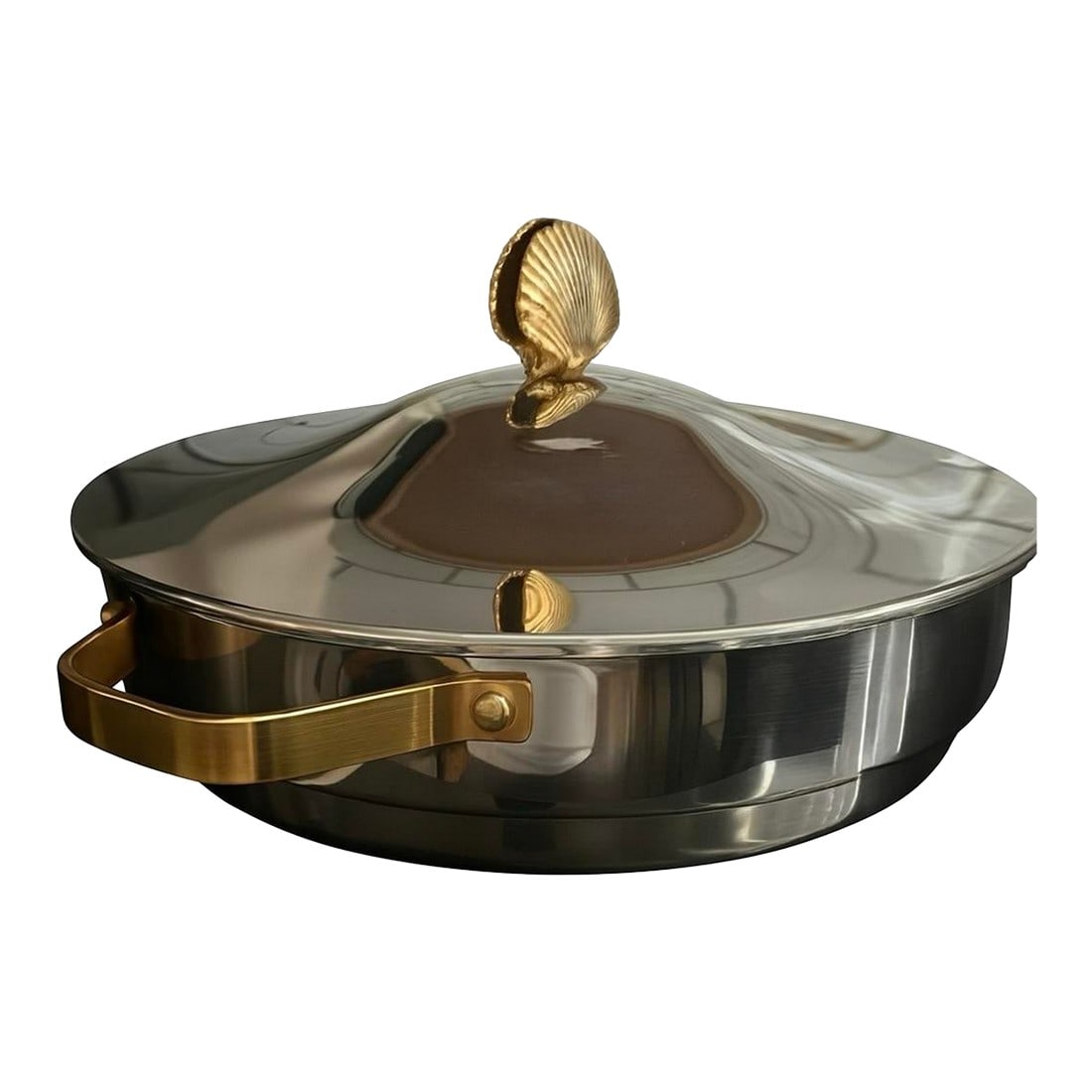 Mid-Century Polished Stainless Pan With Luxe Brass Finial: A striking mid-century mixed-metal piece featuring a polished stainless body and a sculptural solid-brass shell finial. The silhouette, materials, and craftsmanship echo the elevated coastal