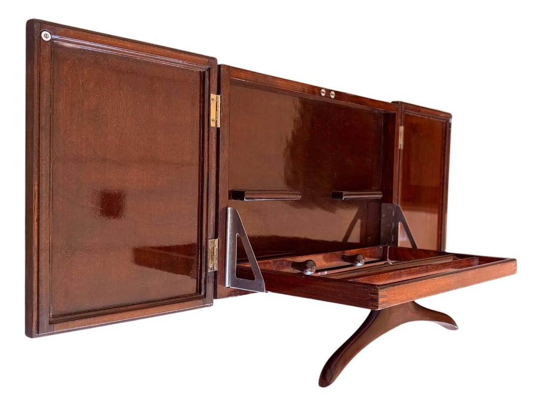 Mid Century Modern Italian Foldable Valet in Mahogany with Hanger: Mid Century Modern Italian Foldable Valet in Mahogany with Hanger The piece must to be fixed to the wall When the piece is opened the total width is 44.88in Condition: Alterations: Unknown