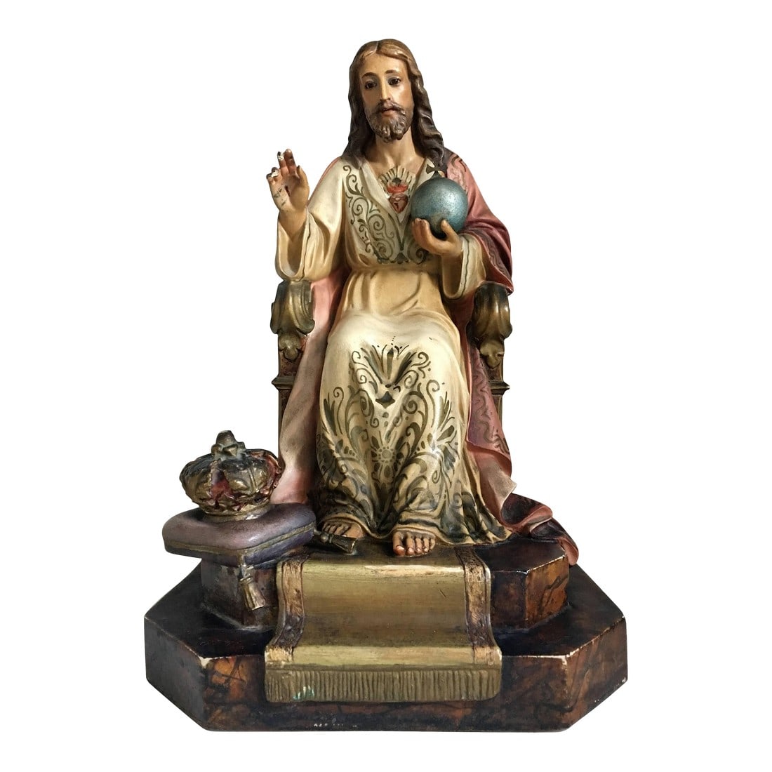 20th Century French Painted and Gilt Statue of Jesus Christ, Sacred Heart: This beautiful statue of Christ was crafted in Spain, circa 1900. The statue features the religious figure standing in a traditional seating pose and showing his Sacred Heart. The sculpture has its