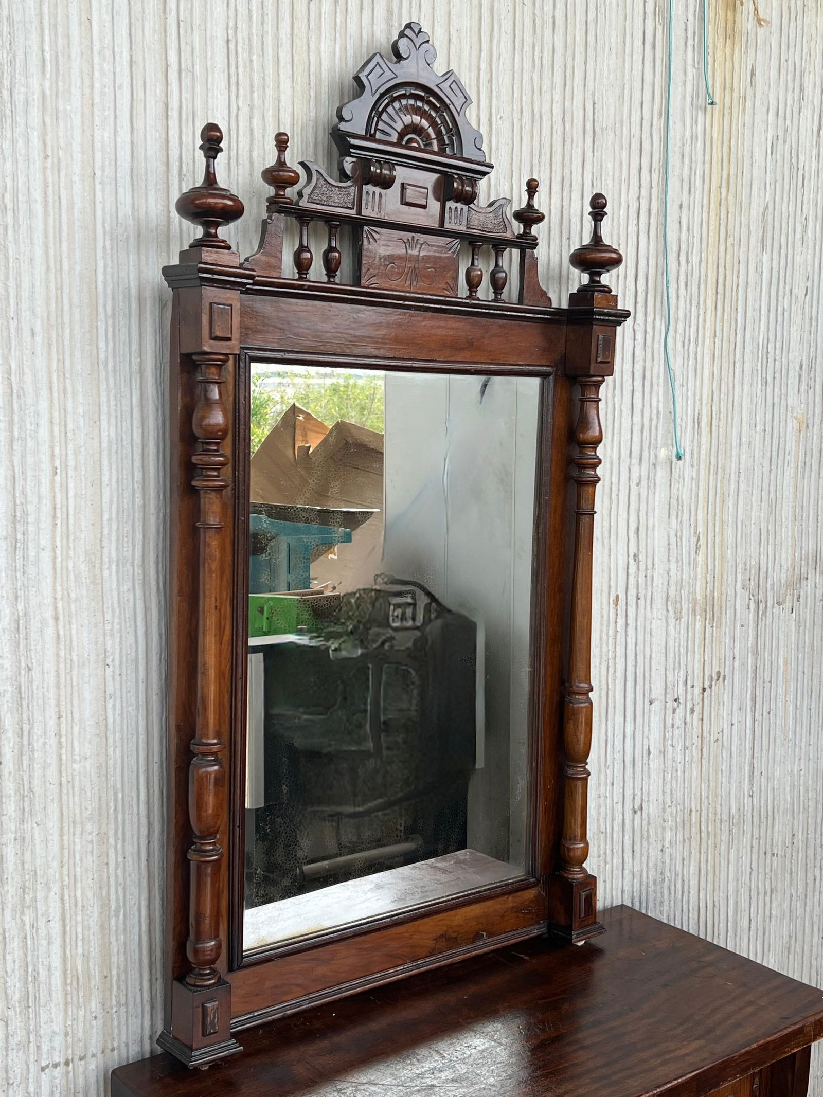 Early 20th French Ebonized Mirror with Turned Columns and High Carved Details - 2