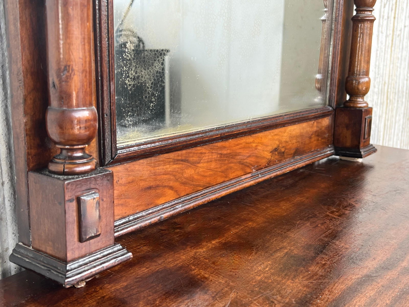 Early 20th French Ebonized Mirror with Turned Columns and High Carved Details - 9