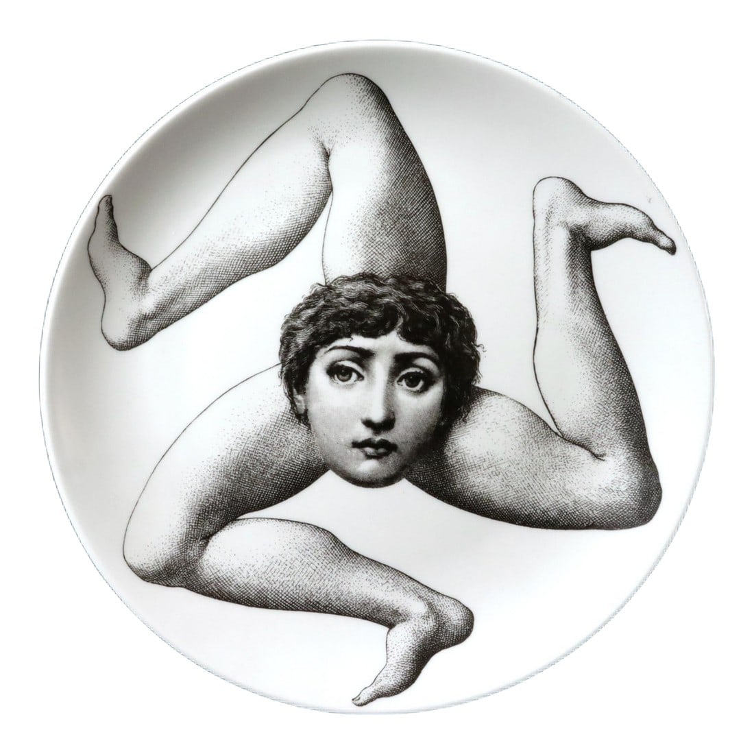 Fornasetti Porcelain Themes & Variation Plate, Number 186: Sicilian Surrealism: Fornasetti "Tema e Variazioni" Trinacria Plate, (Face with Three Legs), 1990's A striking and surreal porcelain wall plate from the iconic "Themes & Variations" (Tema e