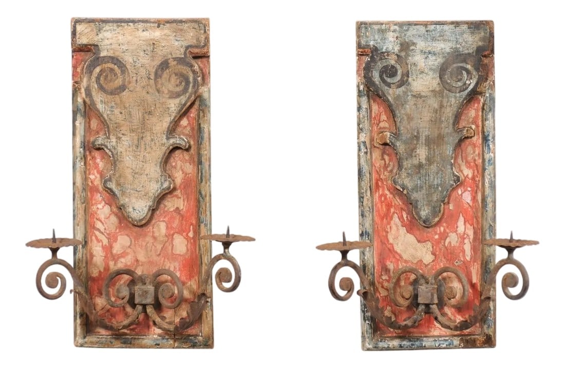 19th Century Italian Wall Mounted Candle Sconces - A Pair: A pair of Italian painted wood wall plaques with iron candle arms from the 19th century. This antique pair of wall decorations from Italy were created with 19th century wall plaques, with vintage