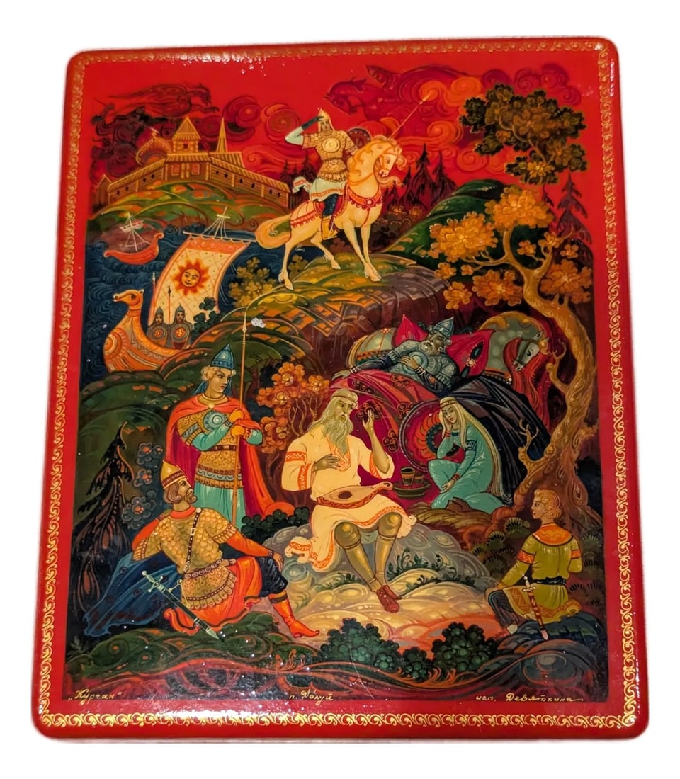 1980s Red Lacquered Fairytale Box of the Tale of Tsar Saltan" – Kholuy Lacquer Box: This box is in the Kholuy style, which is known for being more realistic and "painterly" than the other three main schools (Palekh, Fedoskino, and Mstera). While Palekh boxes usually have black