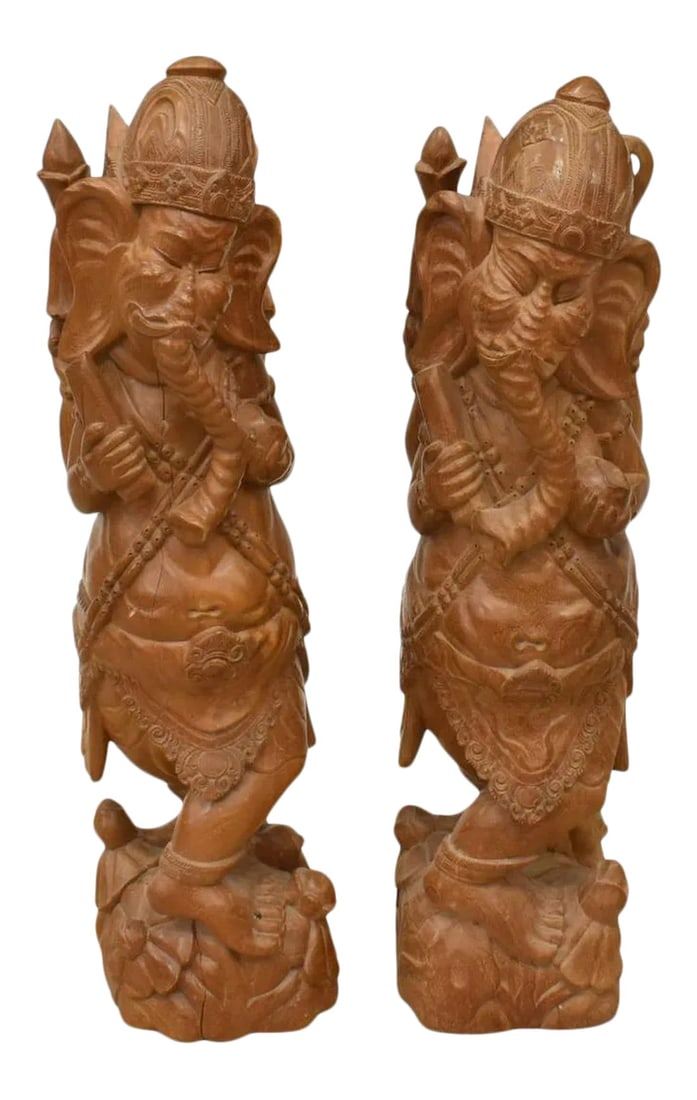 Large Ganesha Elephant God Carved Mango Wood Sculptures - a Pair: This pair of large carved mango wood Hindu God Ganesha sculptures are from India. Each modeled as Lord Ganesha, standing on a budding base. Some minor splits to wood due to drying (see photos). Both