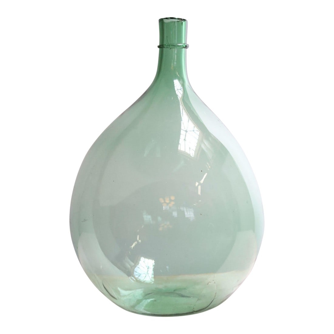Vintage Italian Mouth Blown Glass Bulbous Demijohn in Seafoam Green: Italian Demijohn / Carboy originally used for transporting wine (ca. early 20th Century, Italy). Composed of attractive pale green/light seafoam free-blown glass exhibiting trapped air bubbles within