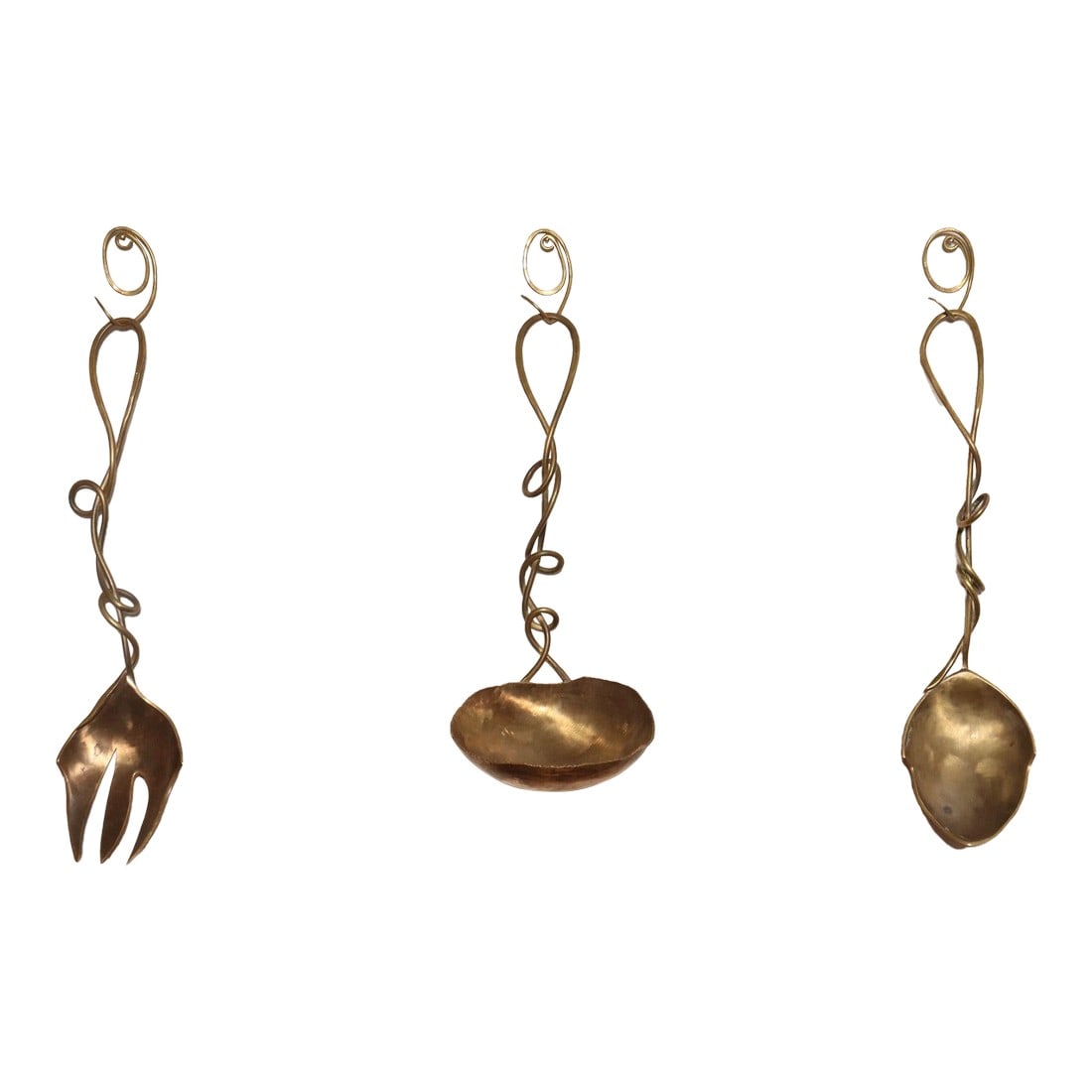 Set of Three Brutalist Brass Decorative Serving Pieces - Ladle, Spoon, and Fork: Brutalist-style brass serving pieces including ladle, spoon, and fork (ca. 1970s, likely Austrian). Intriguing sinuous form handles with hand-forged and hammered details. Intended for both