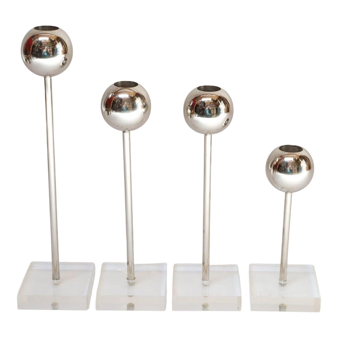 Set of Four Vintage Chrome Orb Candlesticks With Lucite Stems and Bases: Set of four Mid-Century candlesticks (ca. 1970s, USA). Composed of chrome orb-form bulbs supported by cylindrical lucite stems and square bases. Chrome has been newly polished and shows only minor