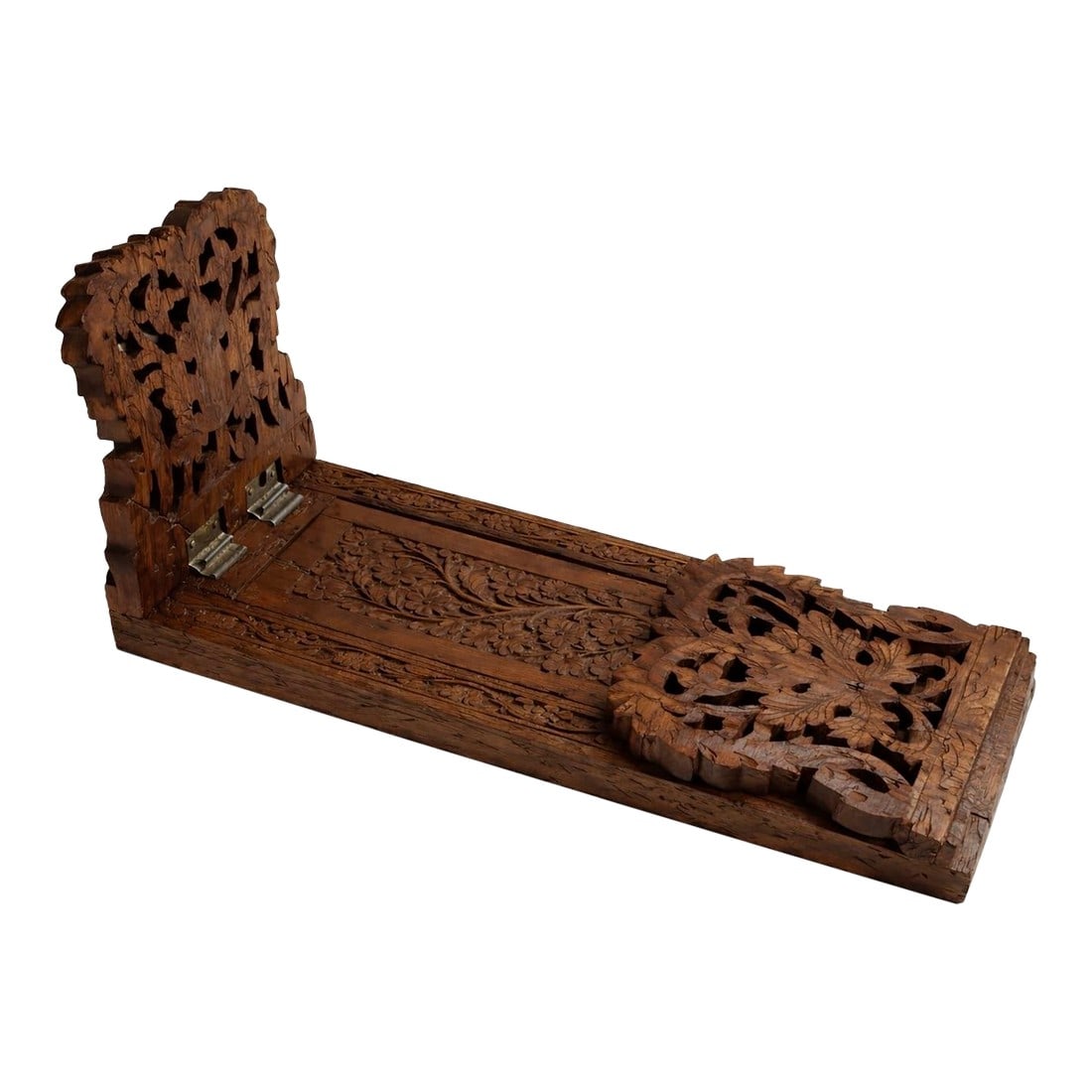 Hand-Carved Hardwood Expandable Novel Rest, Indian, Mid-20th Century: Hand-carved hardwood expandable novel rest from India, mid-20th century. The form features hinged end supports and continuous foliate carving, executed with consistent hand tooling throughout. The