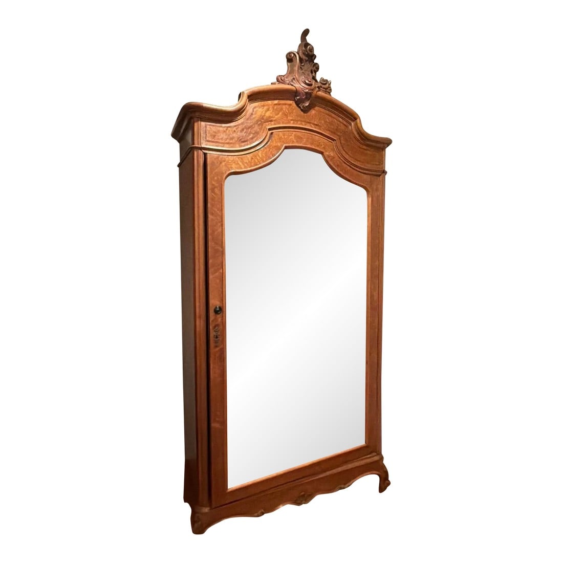 Antique French Rococo Revival Mirrored Armoire With Carved Crest, Circa 1900: Elegant antique French Rococo Revival armoire featuring a full-length mirrored door, carved crest pediment, and gracefully shaped cornice and base. Crafted in warm-toned wood with fine detailing,