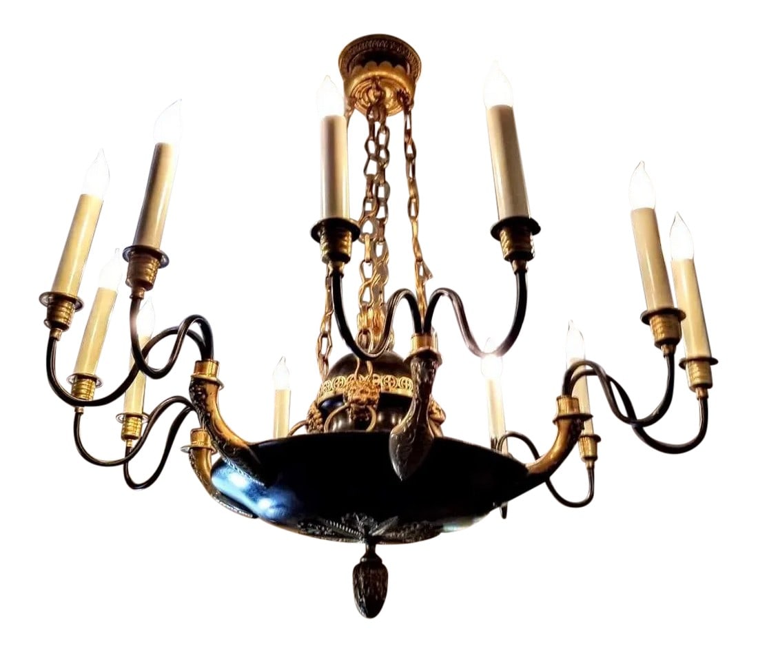 Vintage Charles V or Baroque Style Gilt and Patinated Bronze Chandelier: This vintage chandelier is truly a work of art. In the style of Charles X or Baroque period, it features four chains with twelve lights, and six lion figureheads which were only found in the finest