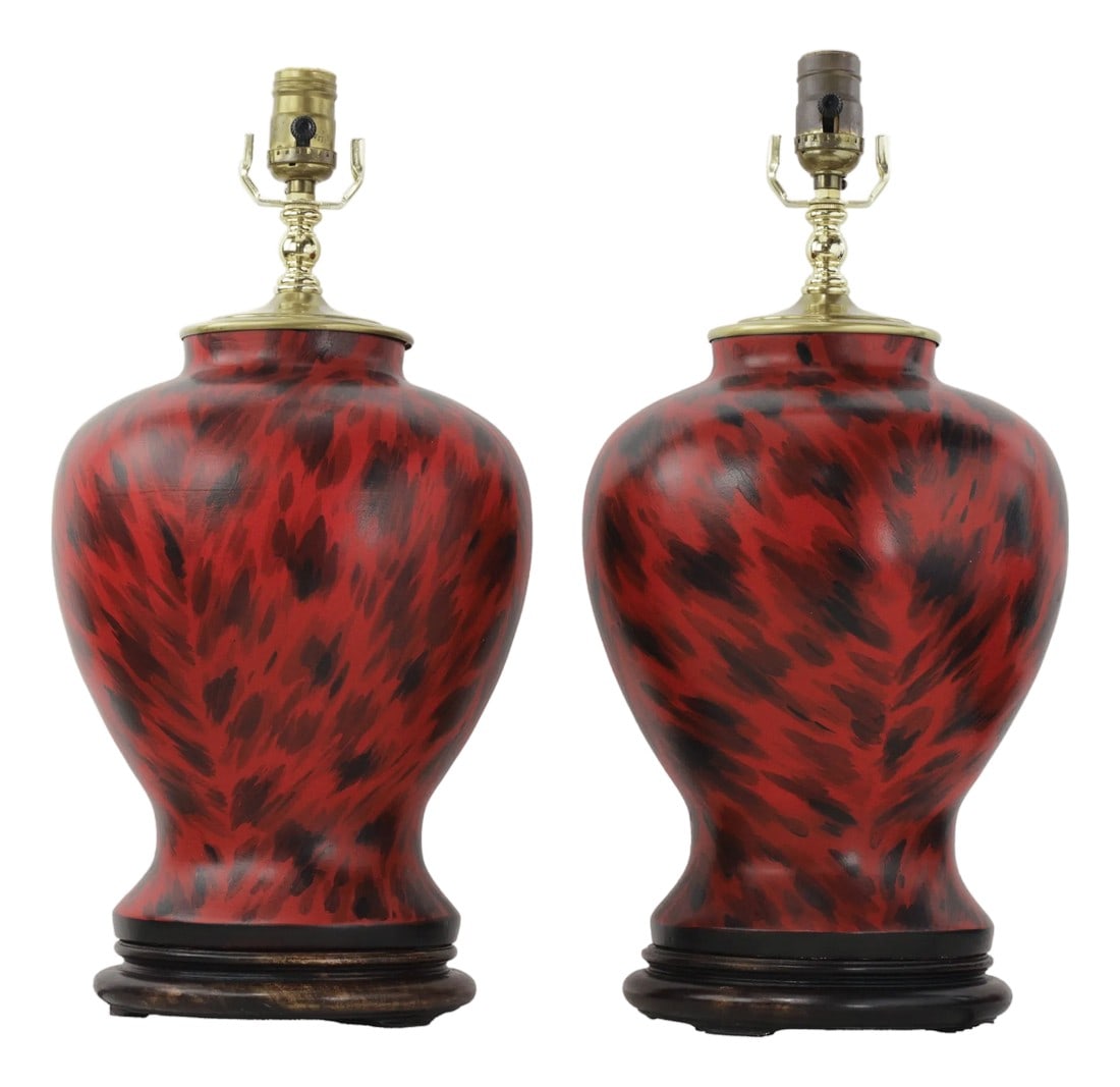 Pair of Vintage Hand Painted Red and Black Tortoiseshell Pattern Porcelain Table Lamps With Wood Bas: This striking pair of vintage table lamps features a classic ginger jar silhouette meticulously hand-painted with a vibrant imitation tortoiseshell pattern. The bold design utilizes a deep red base