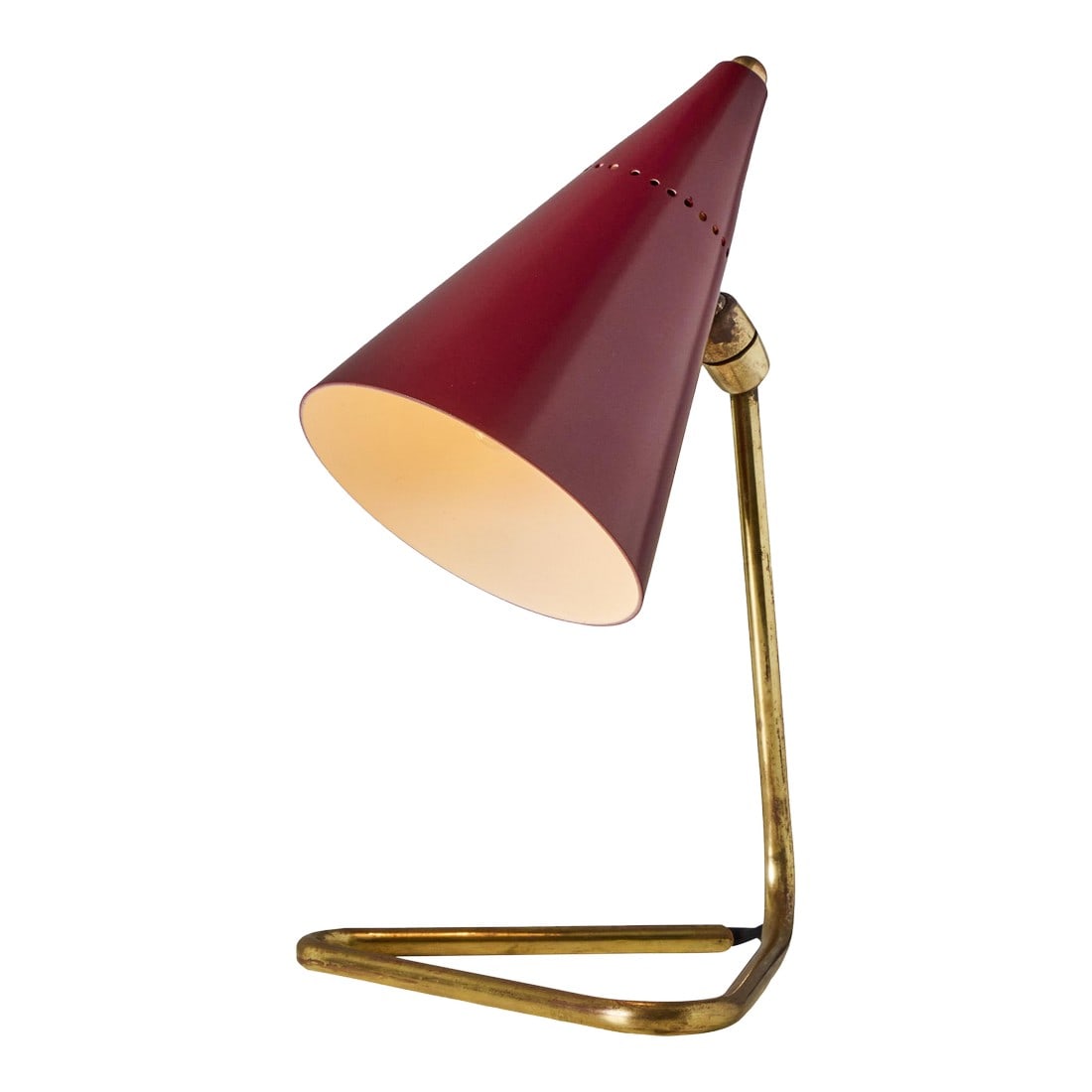 1950s Giuseppe Ostuni Red Conical Table Lamp for Oluce: 1950s Giuseppe Ostuni Red Conical Table Lamp for Oluce A sculptural design executed in enameled red metal and brass. Shade pivots to direct light. A rare table lamp of attractive scale by one of the