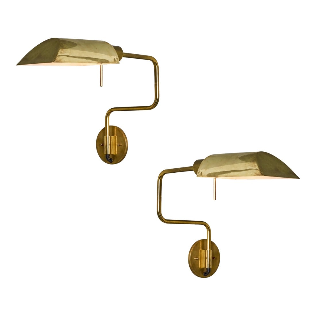 1970s Zonca Articulating Brass Wall Lamps - a Pair: Pair of 1970s Zonca Articulating Brass Wall Lamps Executed in brass and metal, these wall-mounted lights pivot both on the backplate and on the shade to direct a soft downward light where needed. A