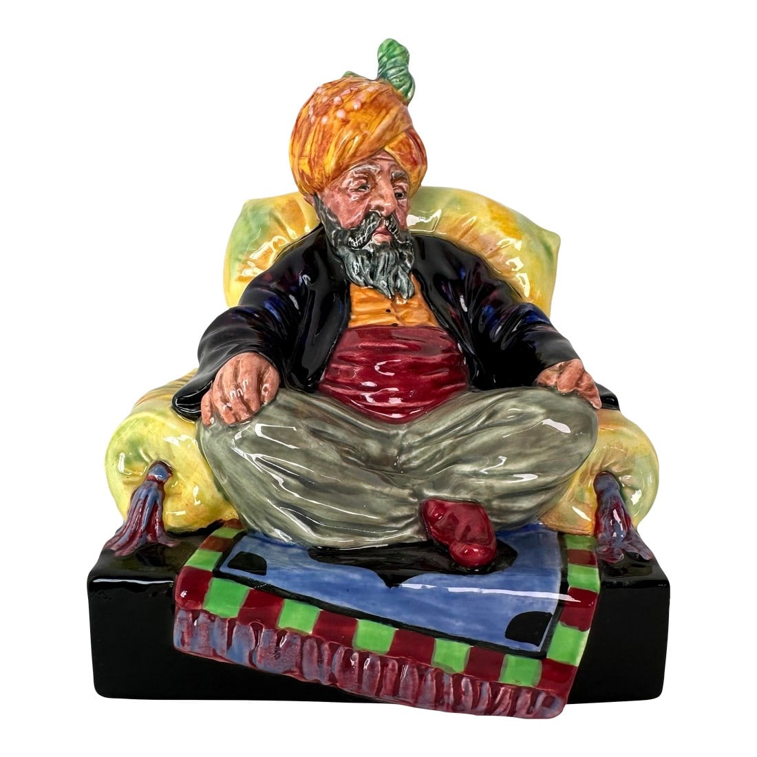 Vintage Royal Doulton Figurine ~ "Abdullah" ~ Hn 2104: This stunning Royal Doulton "Abdullah" HN 2104 figurine is a true work of art, showcasing the vibrant and intricate detailing that Royal Doulton is renowned for. Depicting a seated figure in