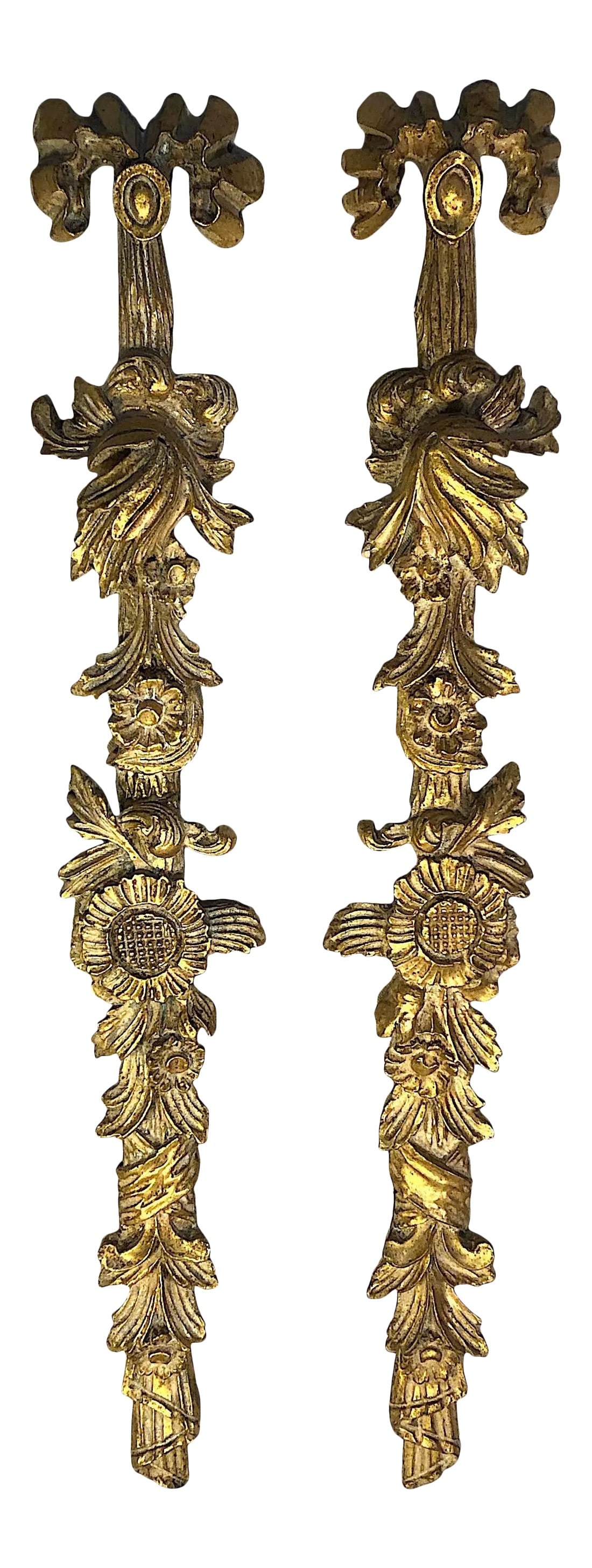 Neoclassical Carved Gilt Wall Swags - Pair: Who wouldn't want to hang out with the lovely pair of Italian carved and gilded wall swags. Descending from a carved ribboned bow fall a bevy of acanthus leaves, blossoms, and sunflowers which end