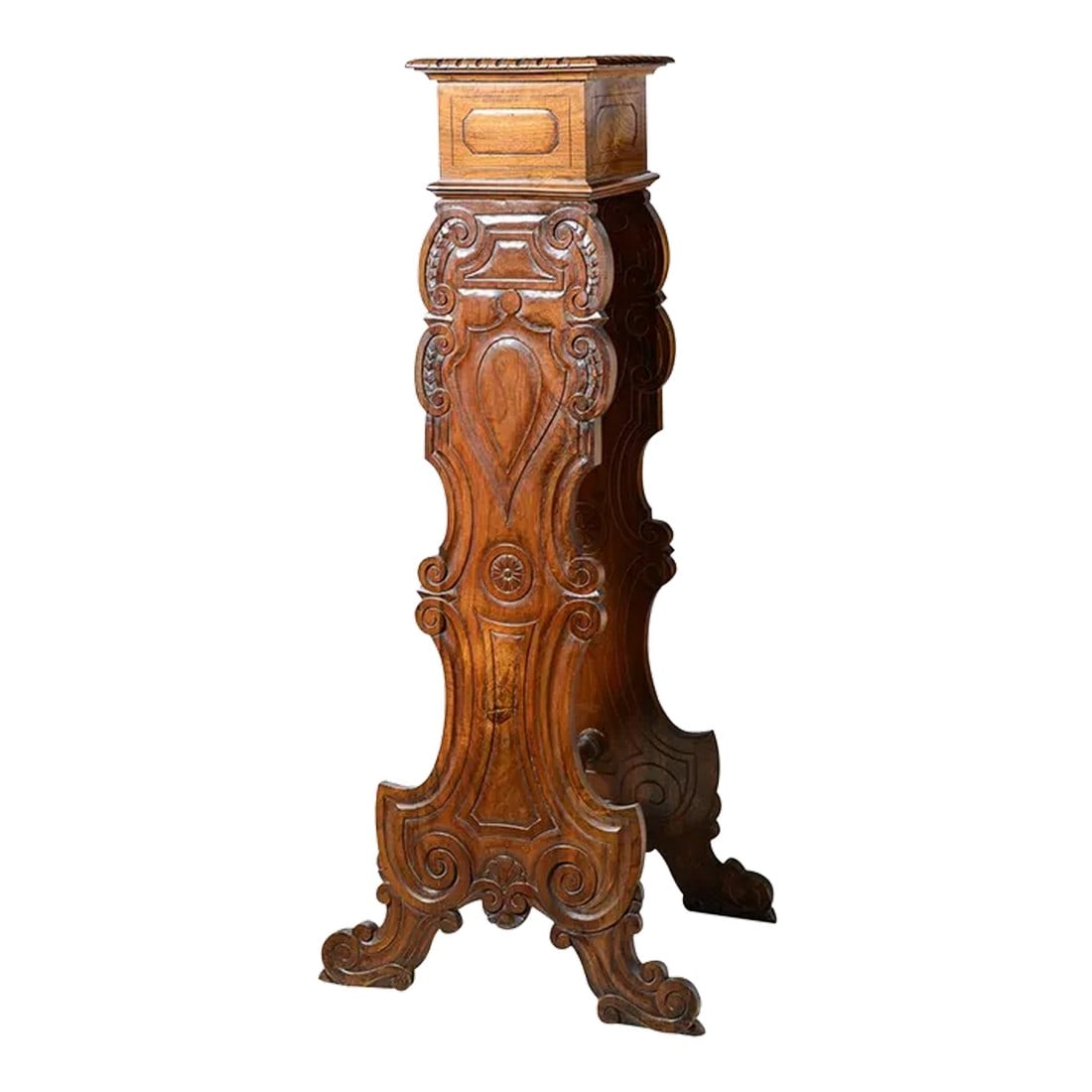 Antique Italian Sgabello Walnut Pedestal: Tall Italian walnut sgabello pedestal for display of busts. It is heavily carved with a variety of interesting shapes with a back mirroring the front panel and connected with a turned wood turning. 