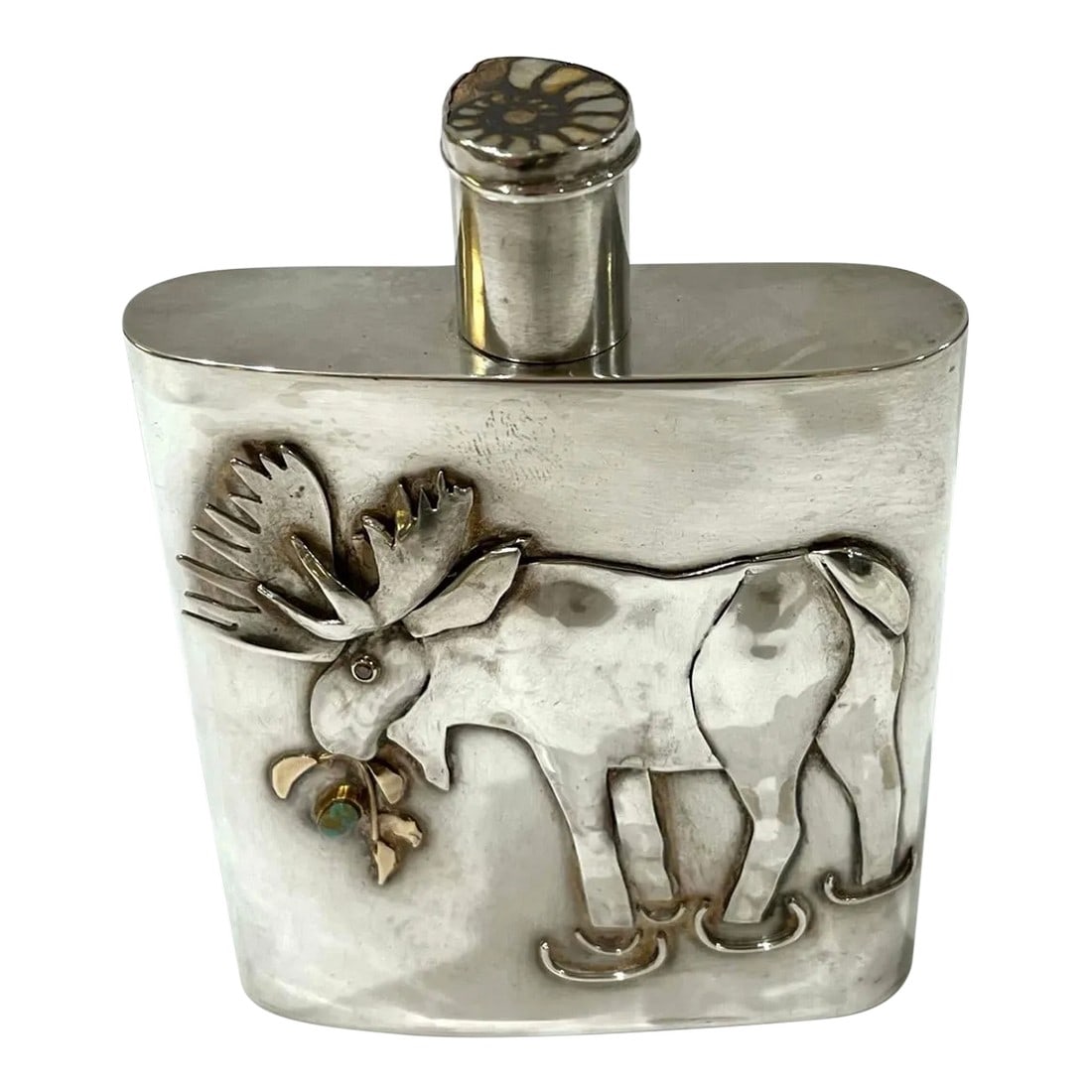 Montana Moose Hand-Forged Sterling Silver and Diamond Flask by Carol Helvey-Woolsey: Deemed one of the west's preeminent metalmiths - Carol "Caye" Helvey-Woolsey was raised on a ranch in Central Montana. Today she leverages that heritage and legacy to create fine jewelry and