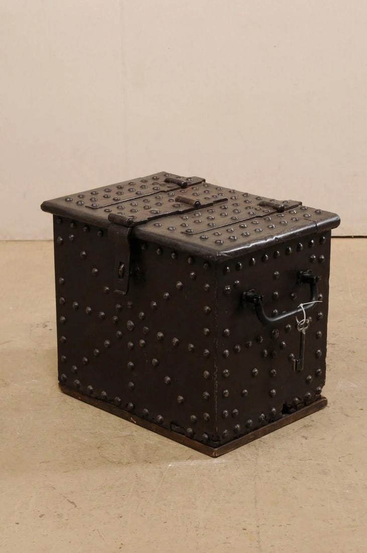 18th Century Iron Clad Wood Strong box, Spain: A Spanish strong box from the 18th century. This antique safe from is constructed or iron clad wood, and is handsomely adorn in domed iron nail head trim throughout it's top, front, and handled