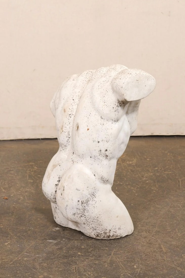 Mid 20th Century French Cast-Stone Nude Male Torso Statue: A French artistic nude male torso statue from the 20th century. This vintage cast-stone sculpture from France depicts a muscular male torso, sculpted from the lower neck to mid knee. The subject is