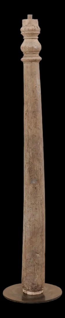 19th Century British Colonial Tapered Wood Column on Stand: A single 19th century British Colonial carved wood column with custom stand. This antique hand-carved wooden architectural element from India, which stands approximately 6.5 feet in height, features a