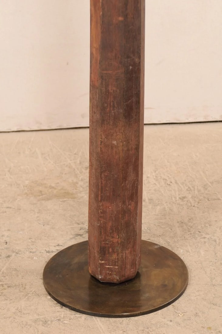 19th Century British Colonial Carved Wood Column on Stand: A single 19th century British Colonial carved wood column with custom stand. This antique hand-carved wooden architectural element from India, which stands just under 6.5 feet in height, features a