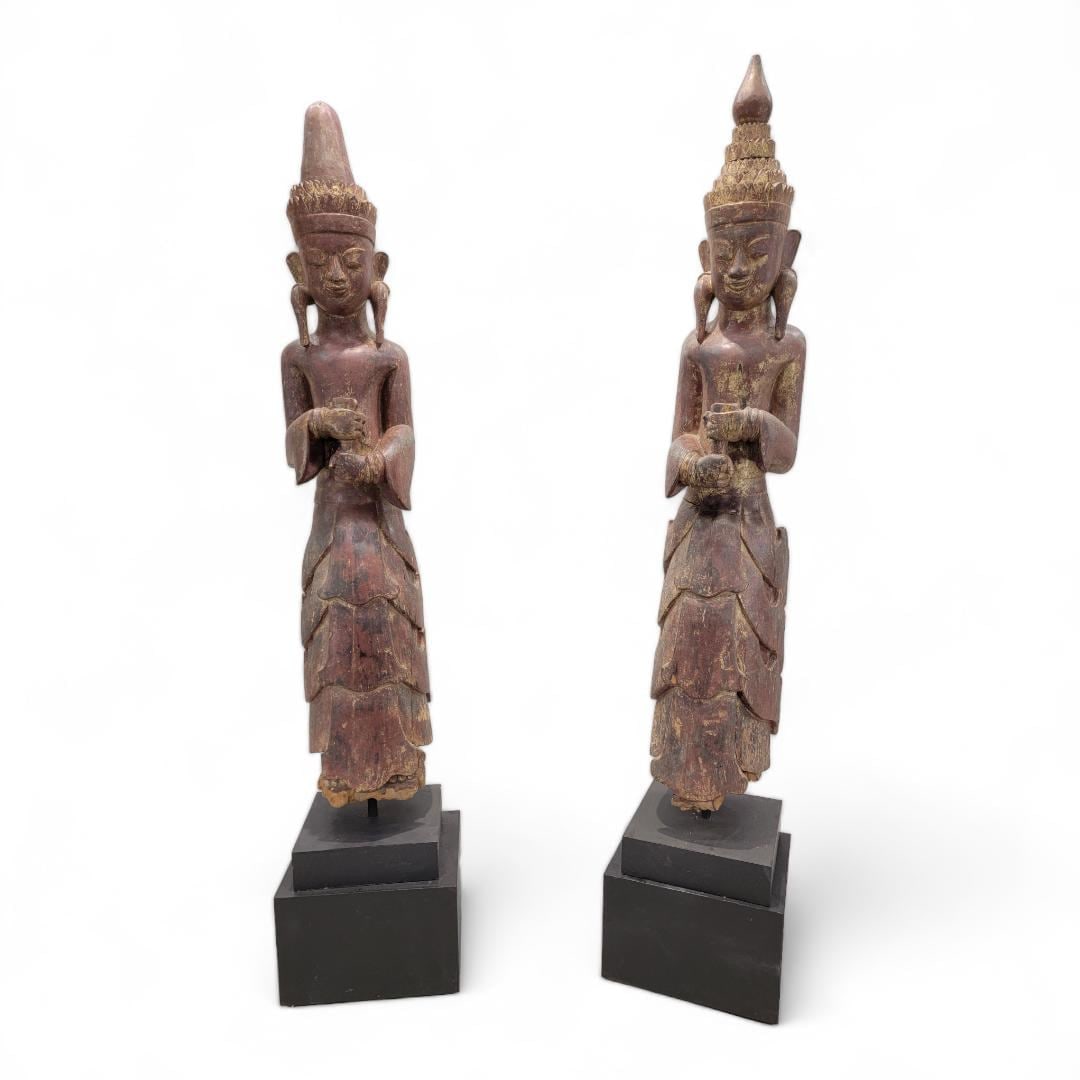 Antique Burmese Monastic Sculptures - Set of 2: Title: Antique Burmese Monastic Sculptures - Set of 2 Description: Antique Carved Natural Patina Dark Brown Lacquered Standing Burmese Monastic Attendant Sculptures on Metal & Wood Pedestal Base -