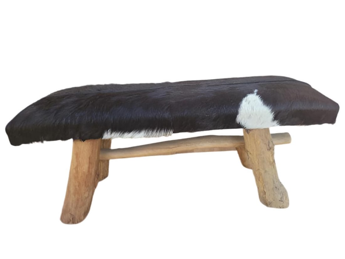 Vintage Rustic Cowhide Bench: Title: Vintage Rustic Cowhide Bench Description: Vintage Black and White Cowhide Bench with Wooden Legs This modernist inspired rectangular bench in expressive black & white cowhide with rustic wooden