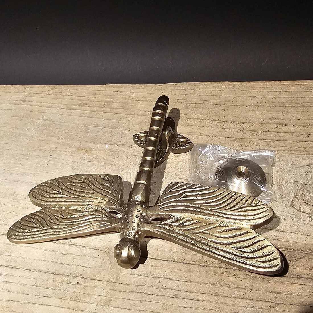 6-1/4" Brass Dragonfly Door Knocker: Title:6-1/4" Brass Dragonfly Door Knocker Description:6-1/2" wide, 4 3/4" Tall" Antiqued but NEW reproduction. Nice heavy quality reproduction solid brass dragonfly door knocker! Reserve: $30.00 Ship