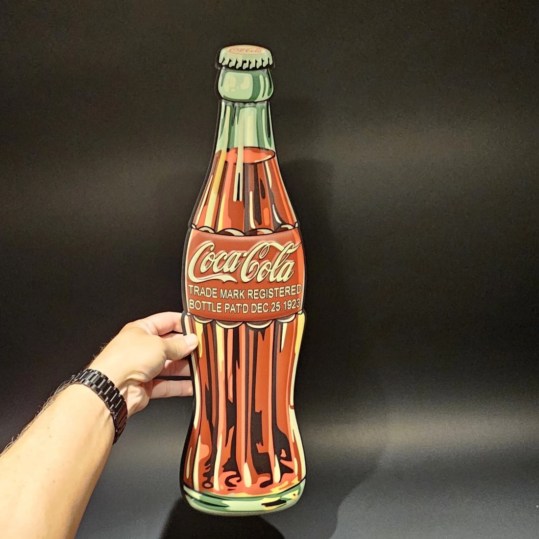 22" Metal Die Cut Coca Cola Bottle Sign: Title:22" Metal Die Cut Coca Cola Bottle SignDescription:22" Long x 6" Wonderful reproduction Coca Cola sign. Good detail styled to look vintage. Certainly hard to tell its age. Reserve: $20.00 