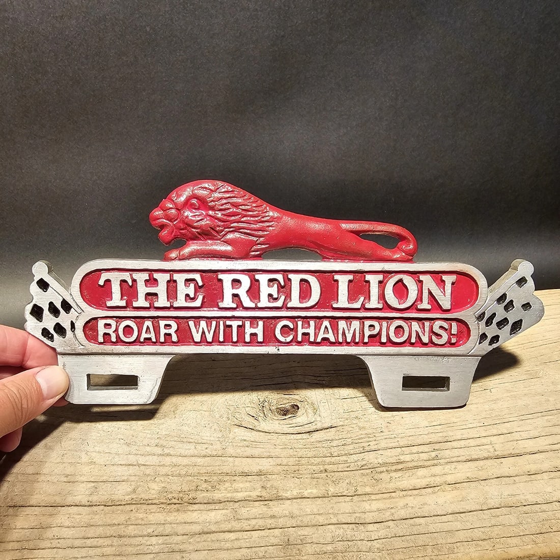 Aluminum Red Lion License Plate Fob Topper: Title:Aluminum Red Lion License Plate Fob TopperDescription:10 1/2" Wide x 4 1/2" Tall Wonderful reproduction license plate topper. Good detail aluminum, slightly aged to look like an antique.