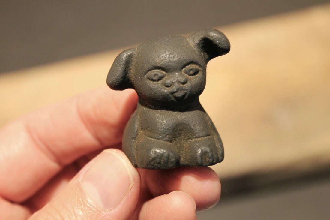 Miniature Cast Iron "Griswold Pup" Dog: Title:Miniature Cast Iron "Griswold Pup" DogDescription:1 1/2" Tall x 1" wide Great little reproduction cast iron "Griswold pup" dog. All cast iron slightly distressed as shown in the images.
