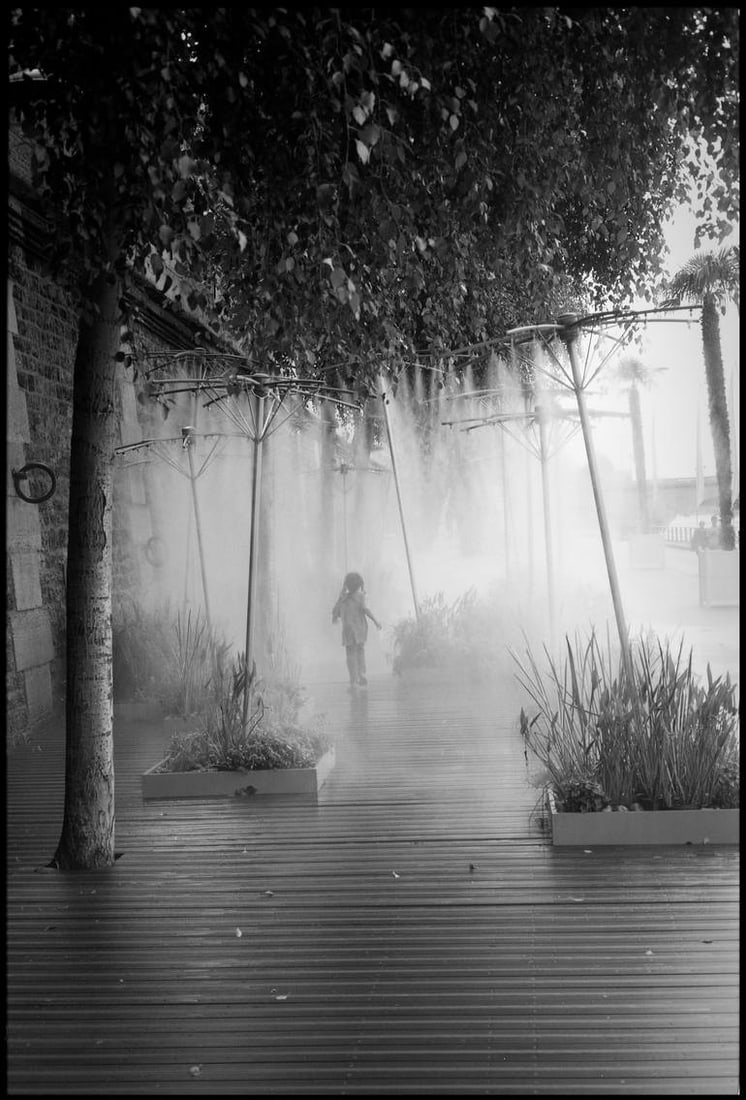 Young Girl, Mist Spray, Paris, France - Silver Gelatin: Title: Young Girl, Mist Spray, Paris, France - Silver Gelatin Description: Title: Young Girl, Mist Spray, Paris, France - Silver Gelatin Photograph - Limited Edition of 10 Artist: Paul Cooklin Origin: