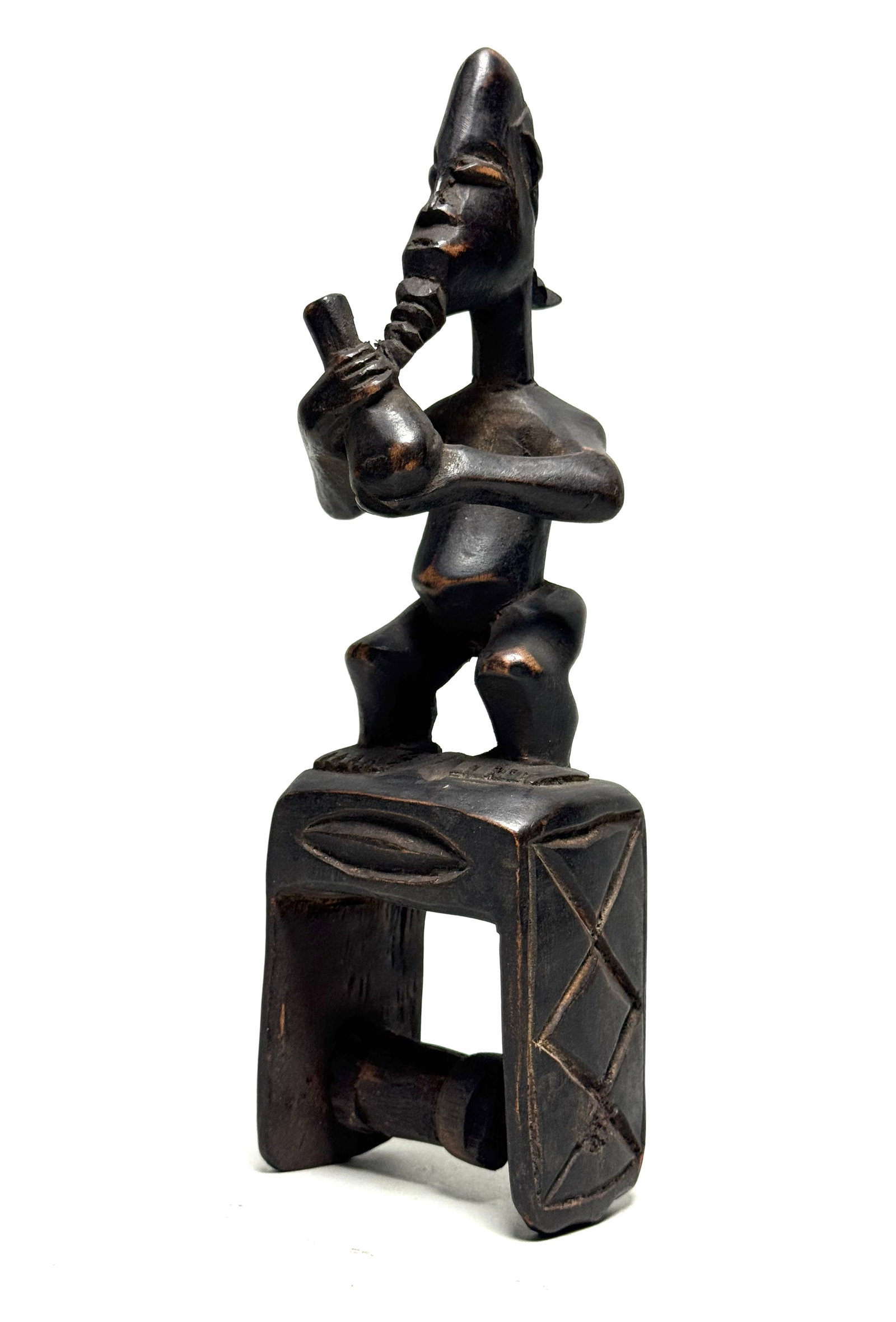 Pulley - Wood - Baule - Ivory Coast: Title: Pulley - Wood - Baule - Ivory Coast Description: A Baule heddle pulley with head and ornaments. In the art of the Baule, decorations have a meaning and can be found on everyday objects such as