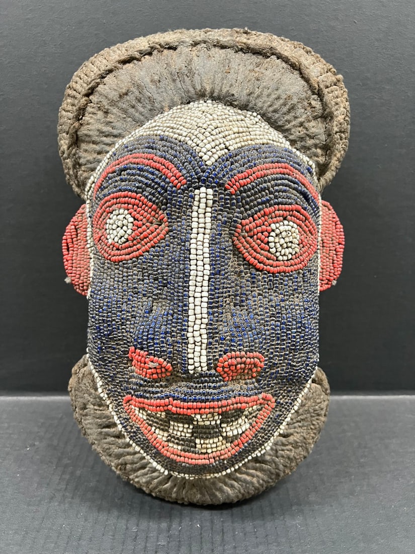 Bamileke Beaded Mask: Title: Bamileke Beaded Mask Description: African Tribal Art Date/Period: Late 20th Century Materials: Wood Size: 16" h x 10" w Reserve: $400.00 Shipping:Domestic: Flat-rate of $40.00 to