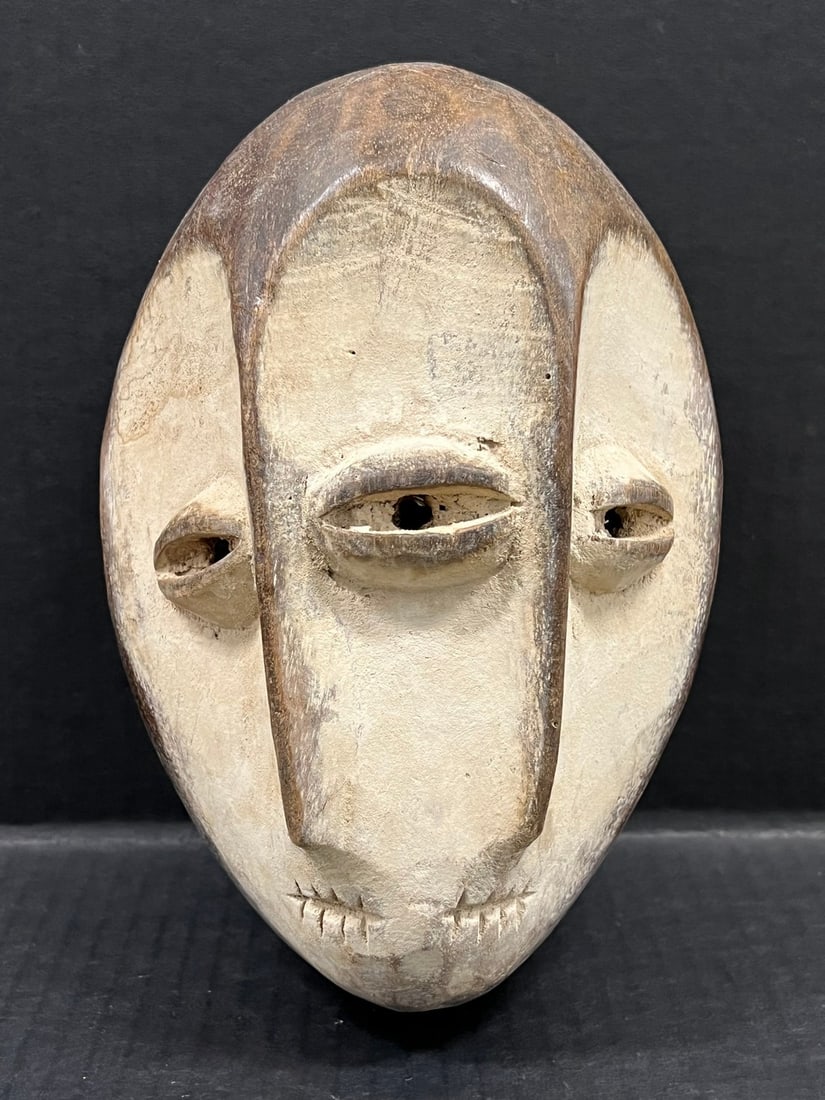 Lega Mask: Title: Lega Mask Description: African Tribal Art Lega Mask Date/Period: Late 20th Century Materials: Wood Size: 10" h x 7" w Reserve: $200.00 Shipping:Domestic: Flat-rate of $30.00 to
