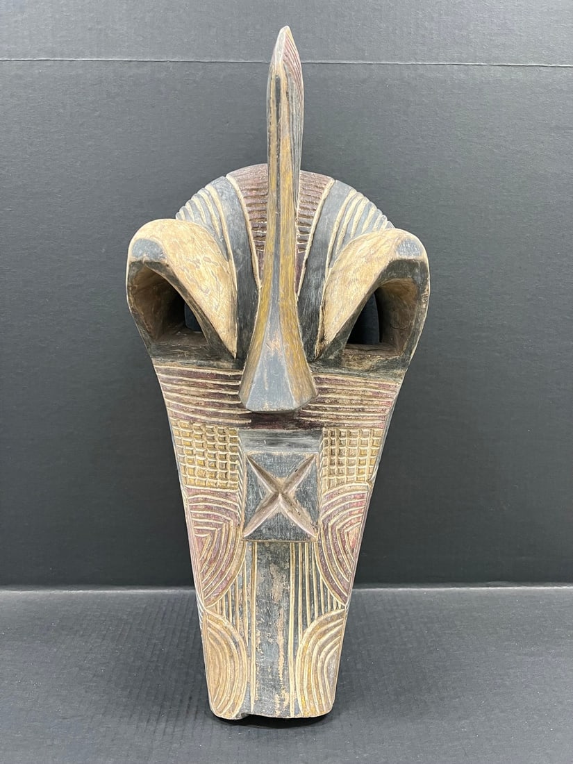 Songye Mask: Title: Songye Mask Description: African Tribal Art Songye Mask Date/Period: Late 20th Century Materials: Wood Size: 24" h x 10" w Reserve: $400.00 Shipping:Domestic: Flat-rate of $40.00