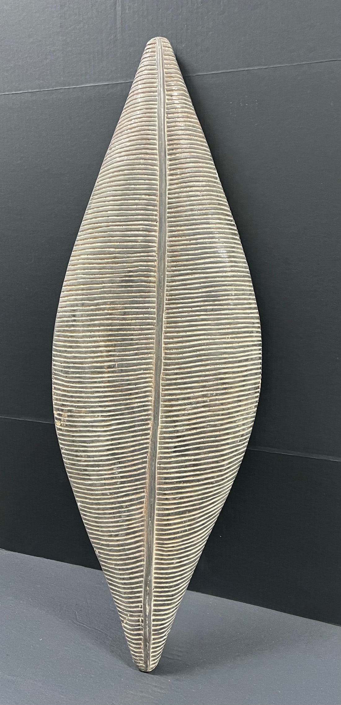 Elongated Zulu Shield: Title: Elongated Zulu Shield Description: African Tribal Art Elongated Zulu Shield Date/Period: Late 20th Century Materials: Wood Size: 39" h x 13" w Reserve: $500.00 