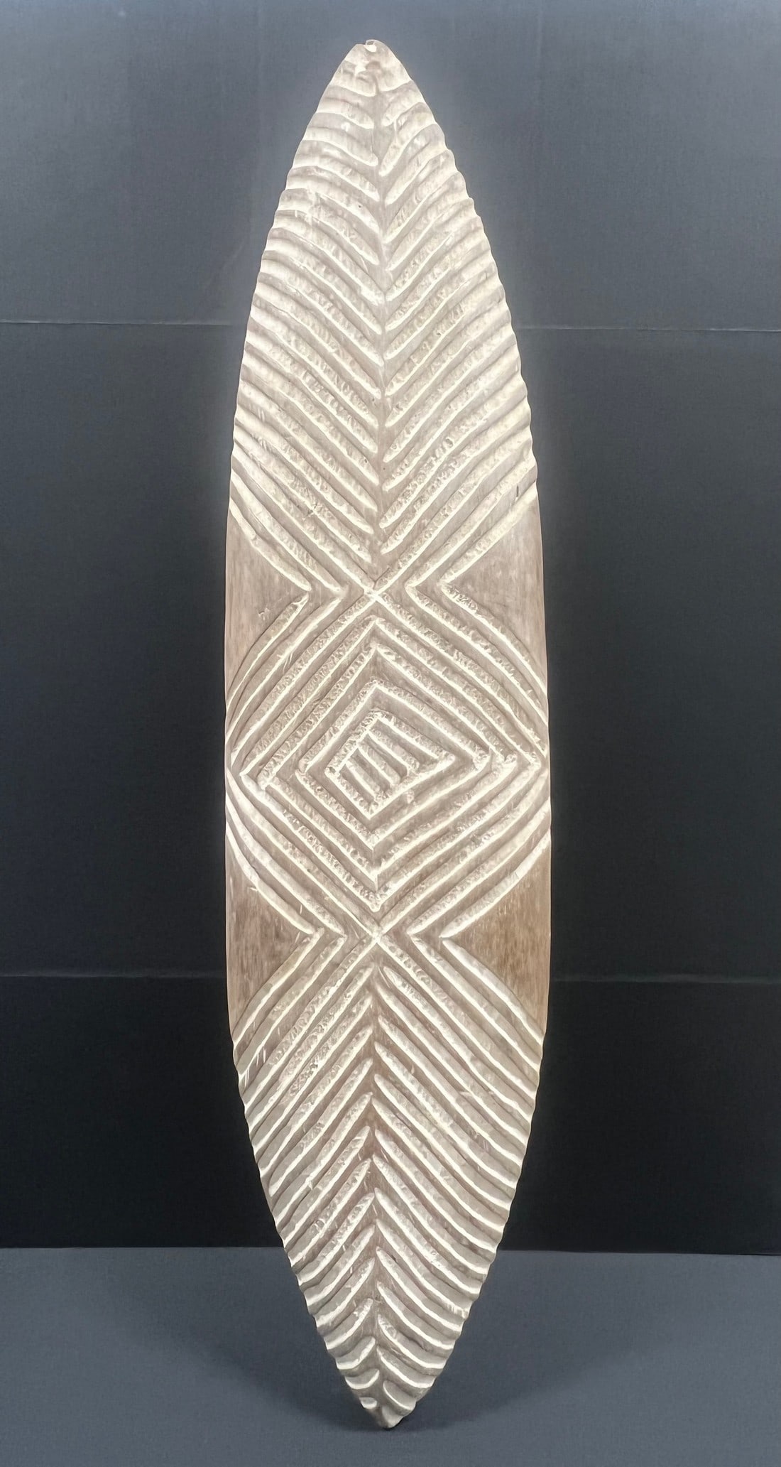 Elongated Zulu Shield: Title: Elongated Zulu Shield Description: African Tribal Art Elongated Zulu Shield Date/Period: Late 20th Century Materials: Wood Size: 45" h x 11'' w Reserve: $500.00 