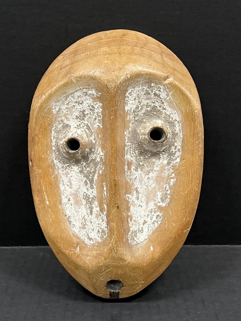 Lega Mask: Title: Lega Mask Description: African Tribal Art Lega Mask Date/Period: Late 20th Century Materials: Wood Size: 9.5" h x 6.5" w Reserve: $200.00 Shipping:Domestic: Flat-rate of $30.00