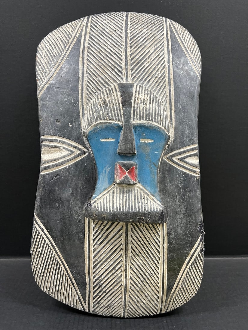 Songye Shield: Title: Songye Shield Description: African Tribal Art Songye Shield Date/Period: Late 20th Century Materials: Wood Size: 23" h x 12' w Reserve: $300.00 Shipping: Domestic: Flat-rate of $40