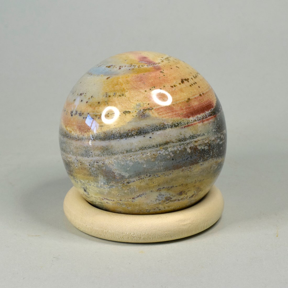 5.8 cm Polished Ocean Jasper sphere: Title: 5.8 cm Polished Ocean Jasper sphere Origin: Madagascar Size: 5.8 cm diameter Description: Species: Jasper (Ocean Jasper) Locality: Madagascar Diameter: 5.8 cm Weight: 0.25 kg Fine polished ocea