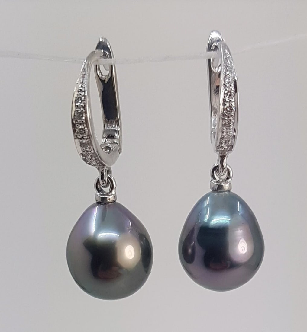 Earrings - 14 kt. White gold - 0.09ct. tw. - 9x10mm Tahitian Pearls: Title: Earrings - 14 kt. White gold - 0.09ct. tw. - 9x10mm Tahitian Pearls Description: Emerging from the tropical lagoons of French Polynesia, these Tahitian pearls have been hand selected for their