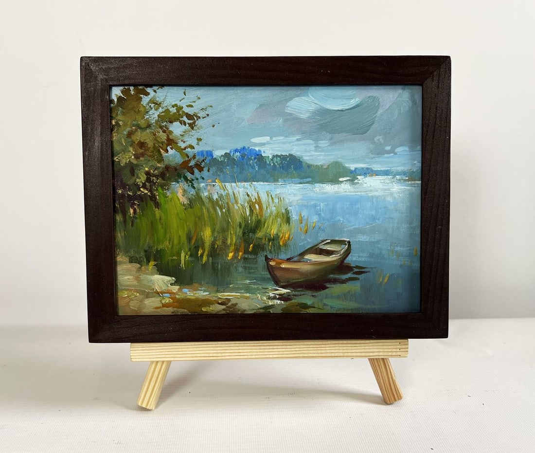Oil painting A boat among the reeds Yuriy Suprunchuk: Title: Oil painting A boat among the reeds Yuriy Suprunchuk Description: NoAAA4433The painting "A Boat Among the Reeds" captures a tranquil riverside scene where a lone wooden boat rests quietly in th