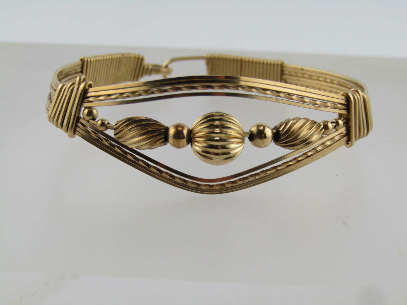 Vintage Wrapped & Beaded Bracelet, 6", 10kt & 14kt Gold Filled, 1980's-1990's: Vintage Wrapped & Beaded Bracelet, 6", 10kt & 14kt Gold Filled, 1980's-1990's. 7.80 grams. Very intricated and tightly wrapped 10kt gold filled and 14kt gold filled bracelet - some wire tests as